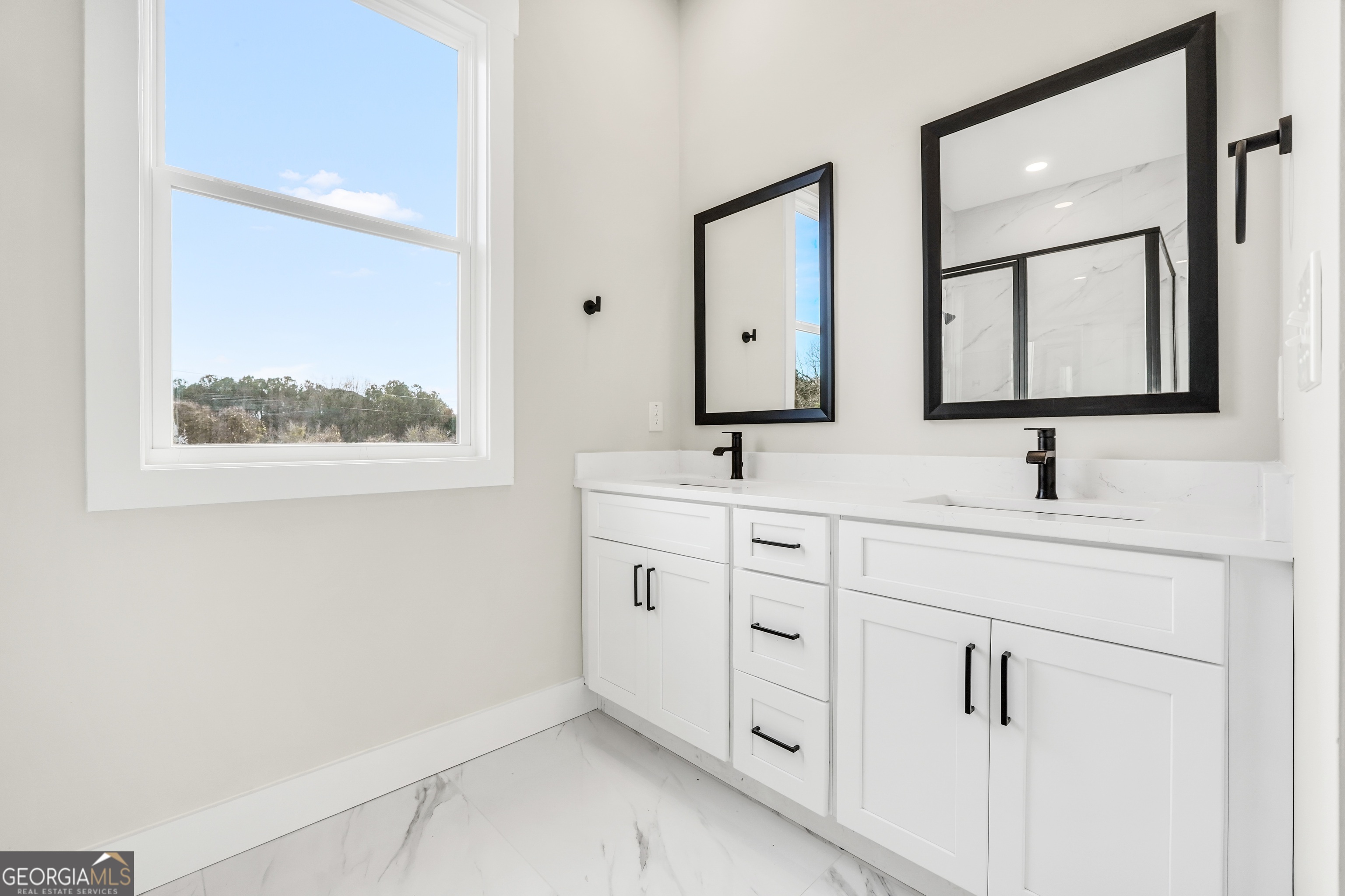 297 East Knight Road McDonough, GA 30252 - Photo 34 of 64 a bathroom with a double vanity sink mirror and