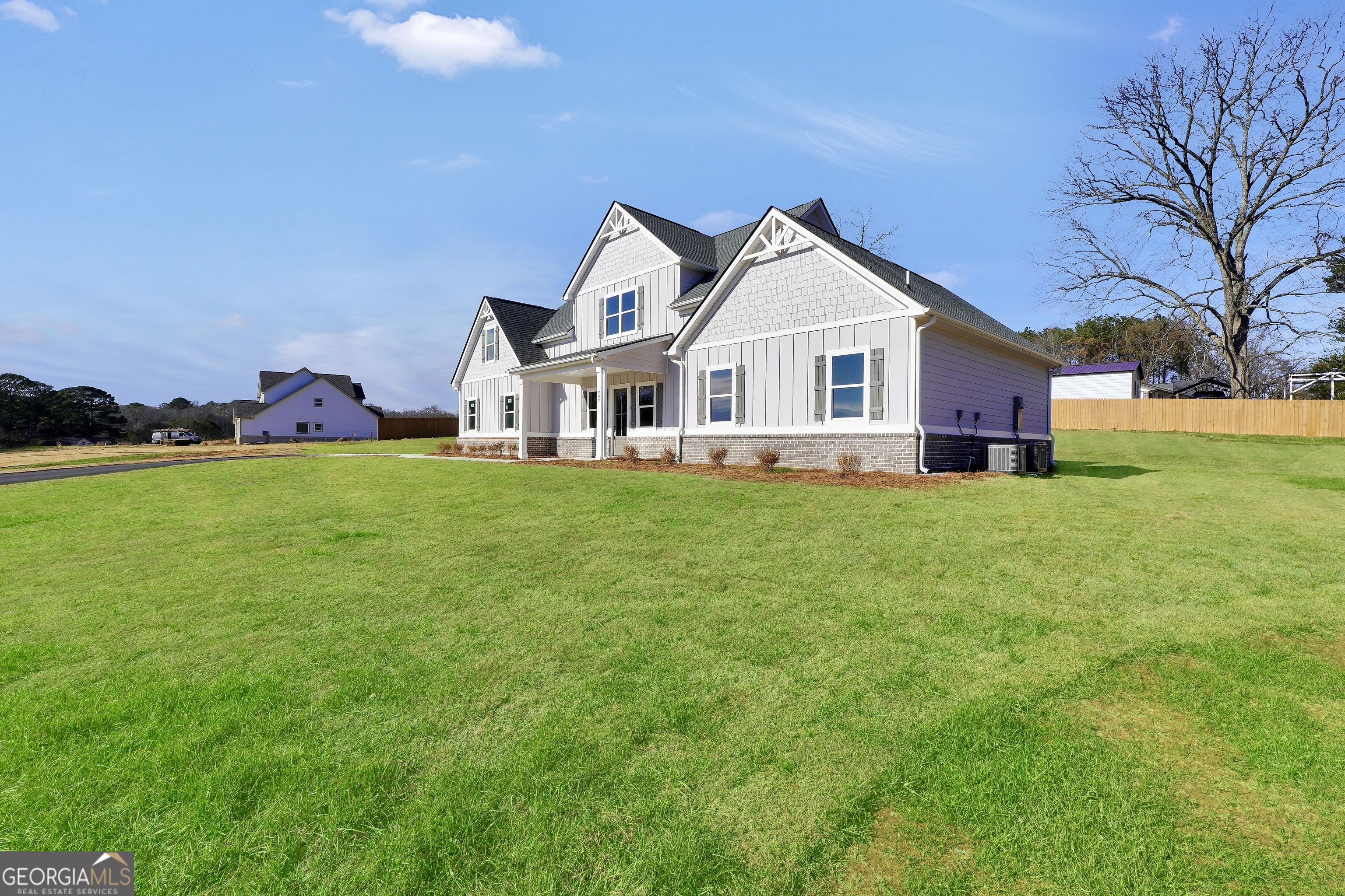 297 East Knight Road McDonough, GA 30252 - Photo 4 of 64 a view of a house with a big yard and large trees