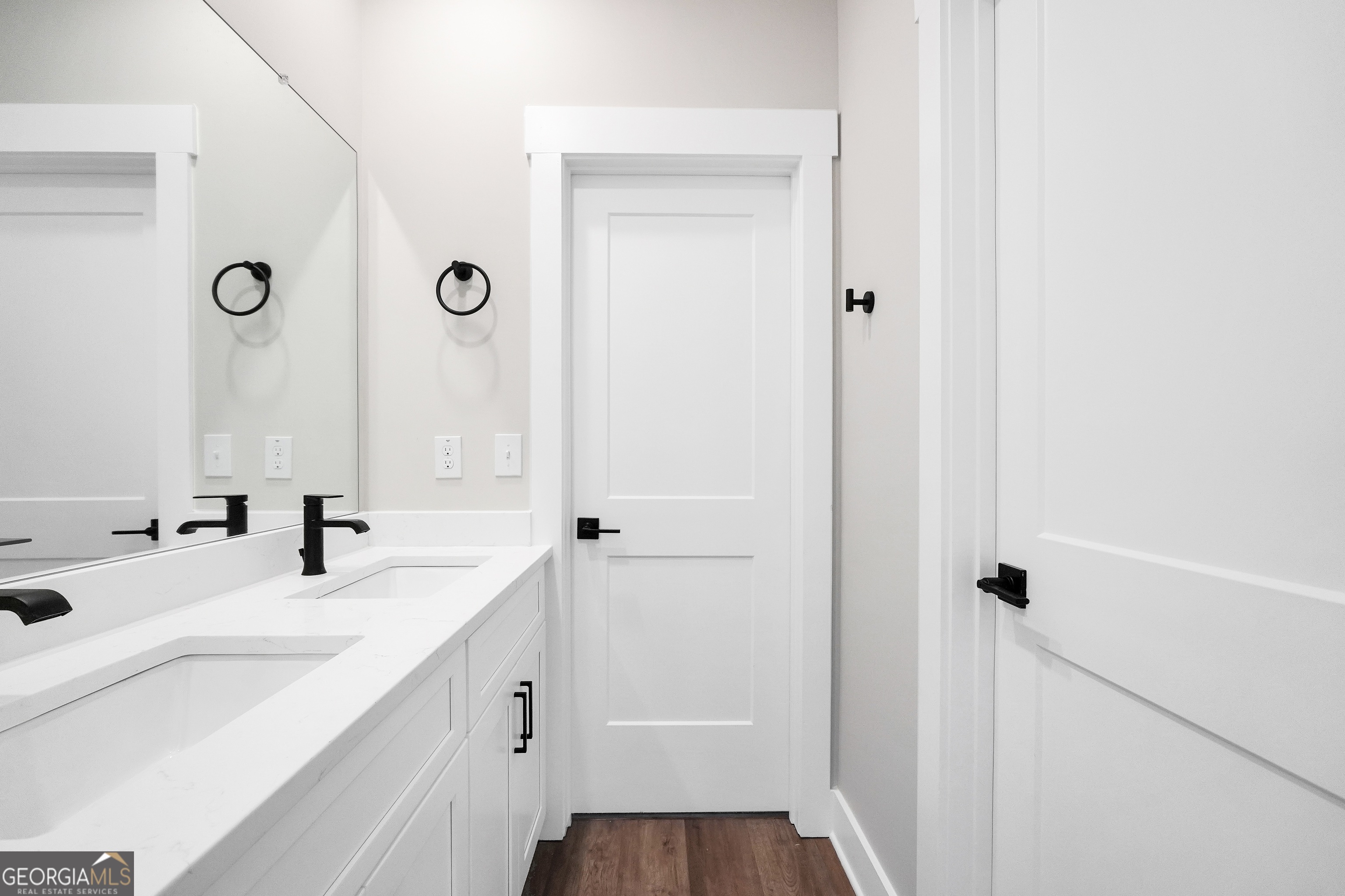 297 East Knight Road McDonough, GA 30252 - Photo 45 of 64 a bathroom with a double vanity sink a mirror and shower