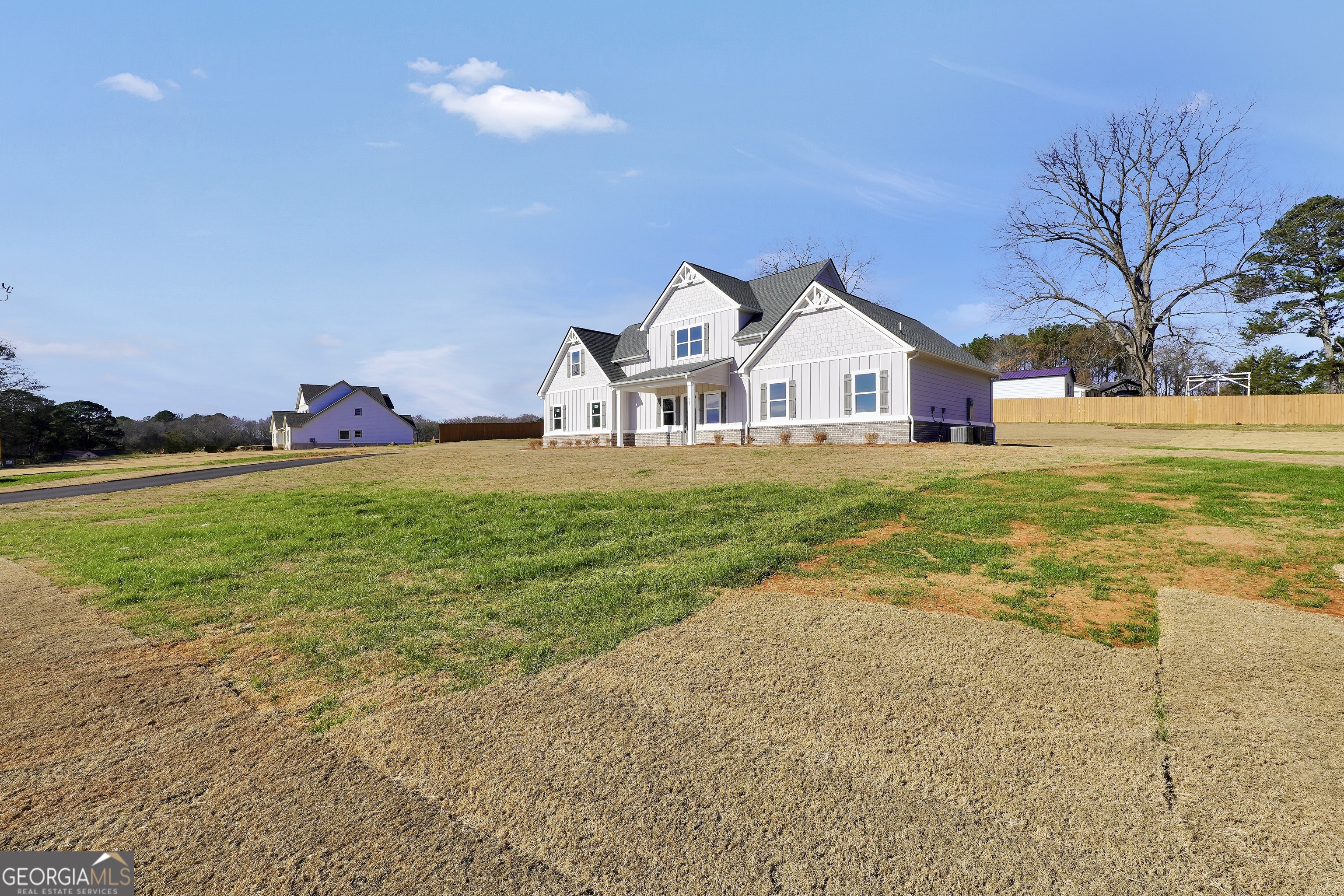 297 East Knight Road McDonough, GA 30252 - Photo 5 of 64 a view of a house with a big yard and large trees