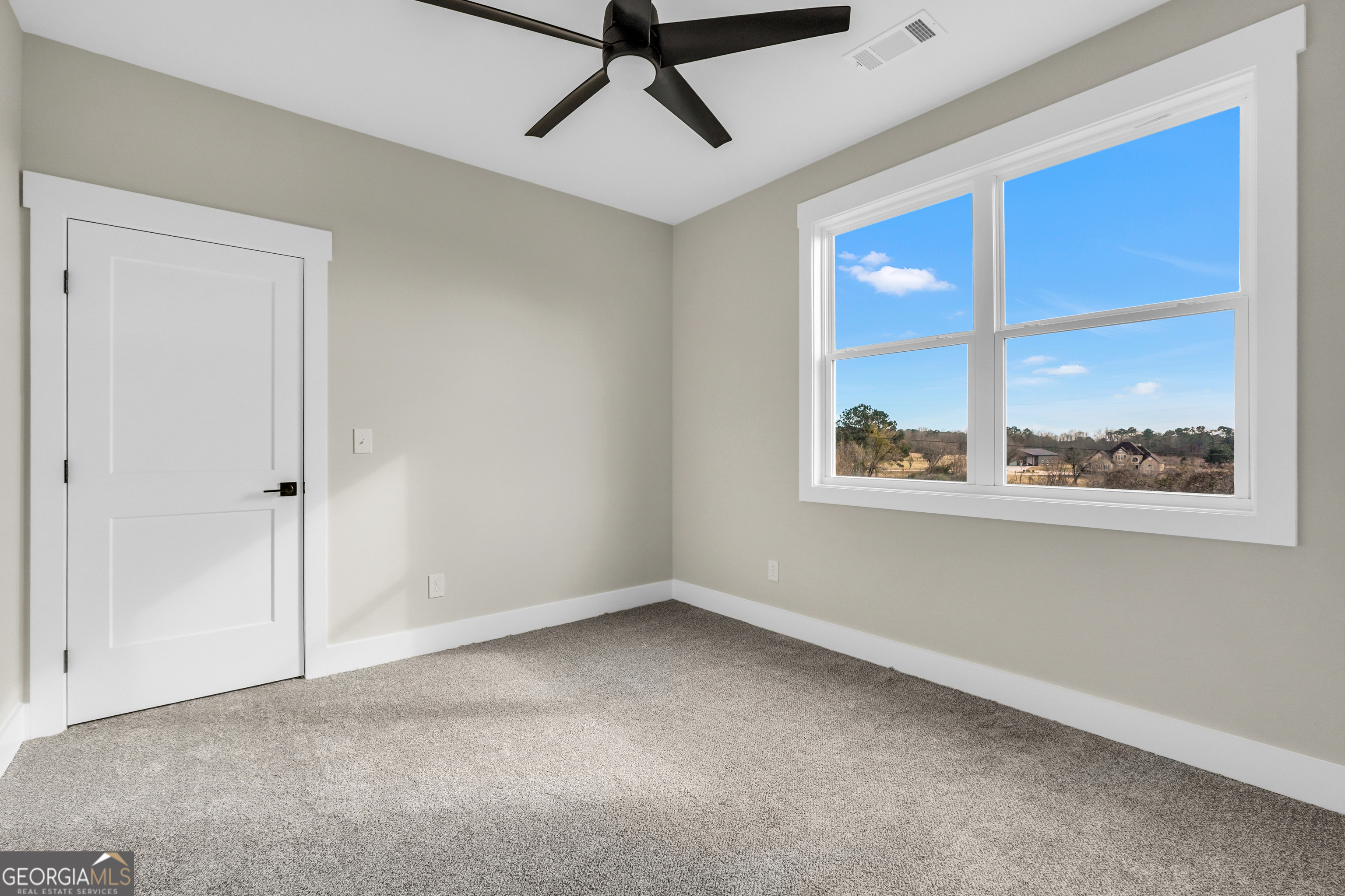 297 East Knight Road McDonough, GA 30252 - Photo 51 of 64 a view of room with window and ceiling fan