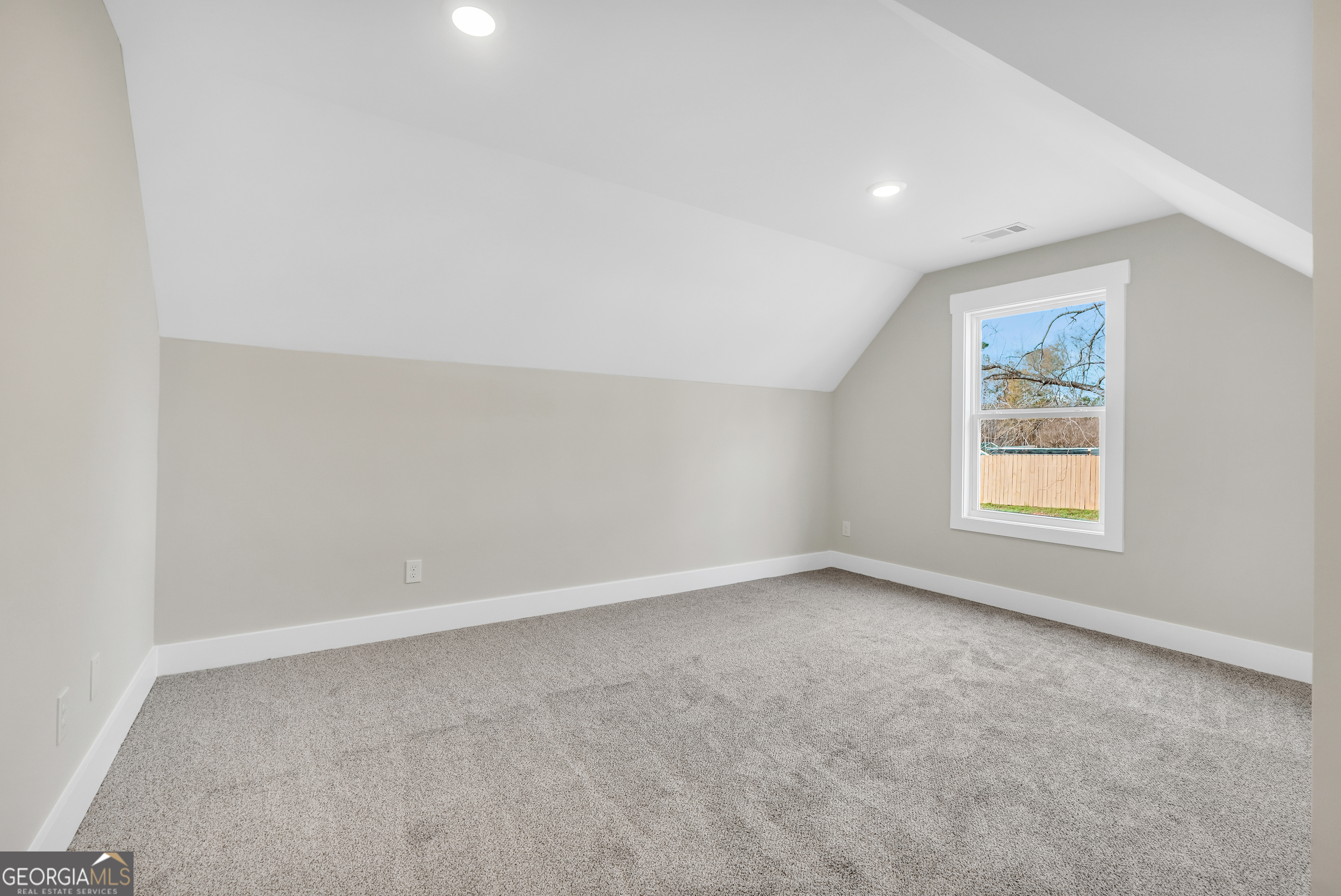 297 East Knight Road McDonough, GA 30252 - Photo 57 of 64 an empty room with a window