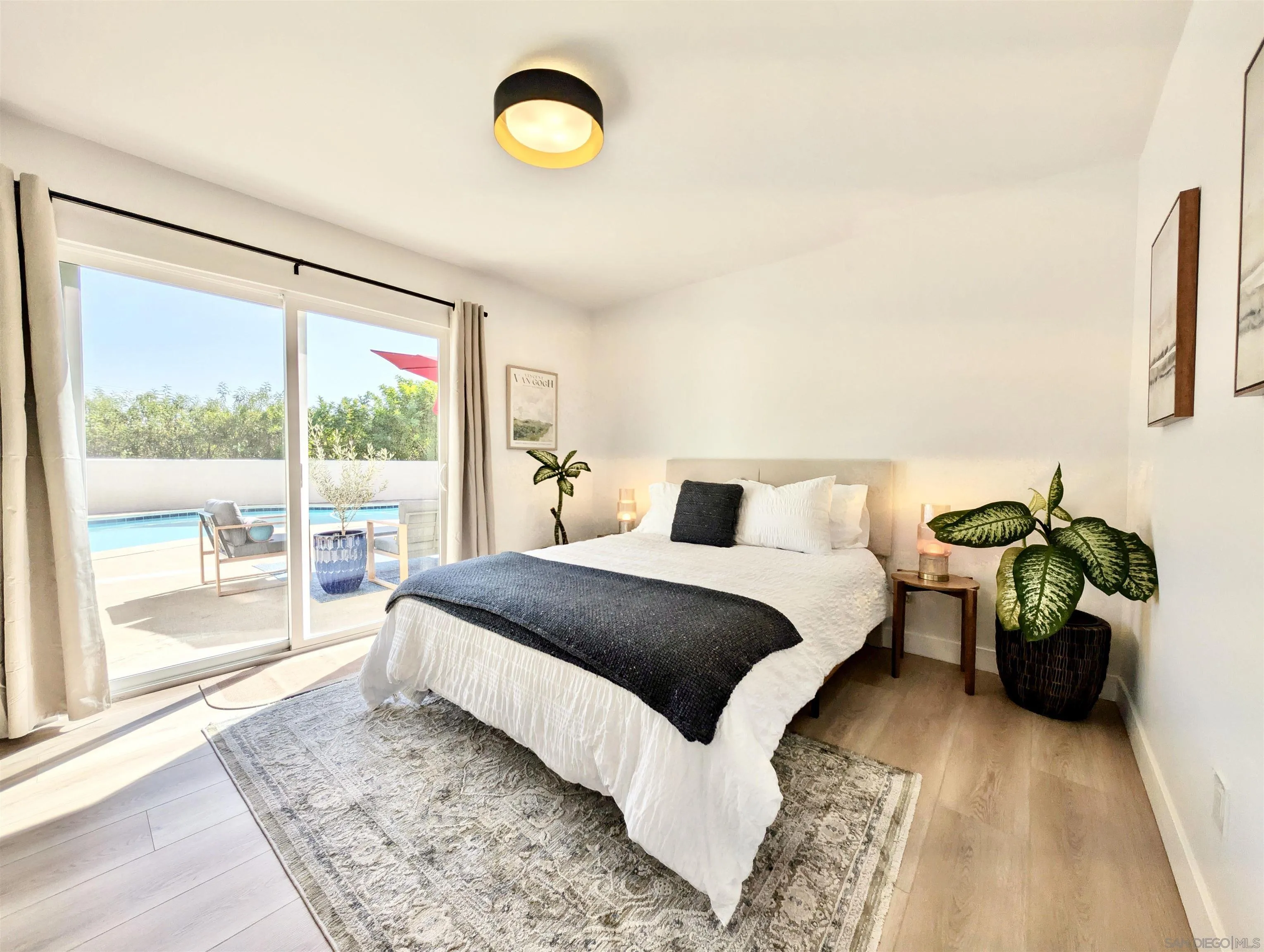 4242 Avenida Gregory Spring Valley, CA 91977 - Photo 35 of 53 a spacious bedroom with a bed and a large window