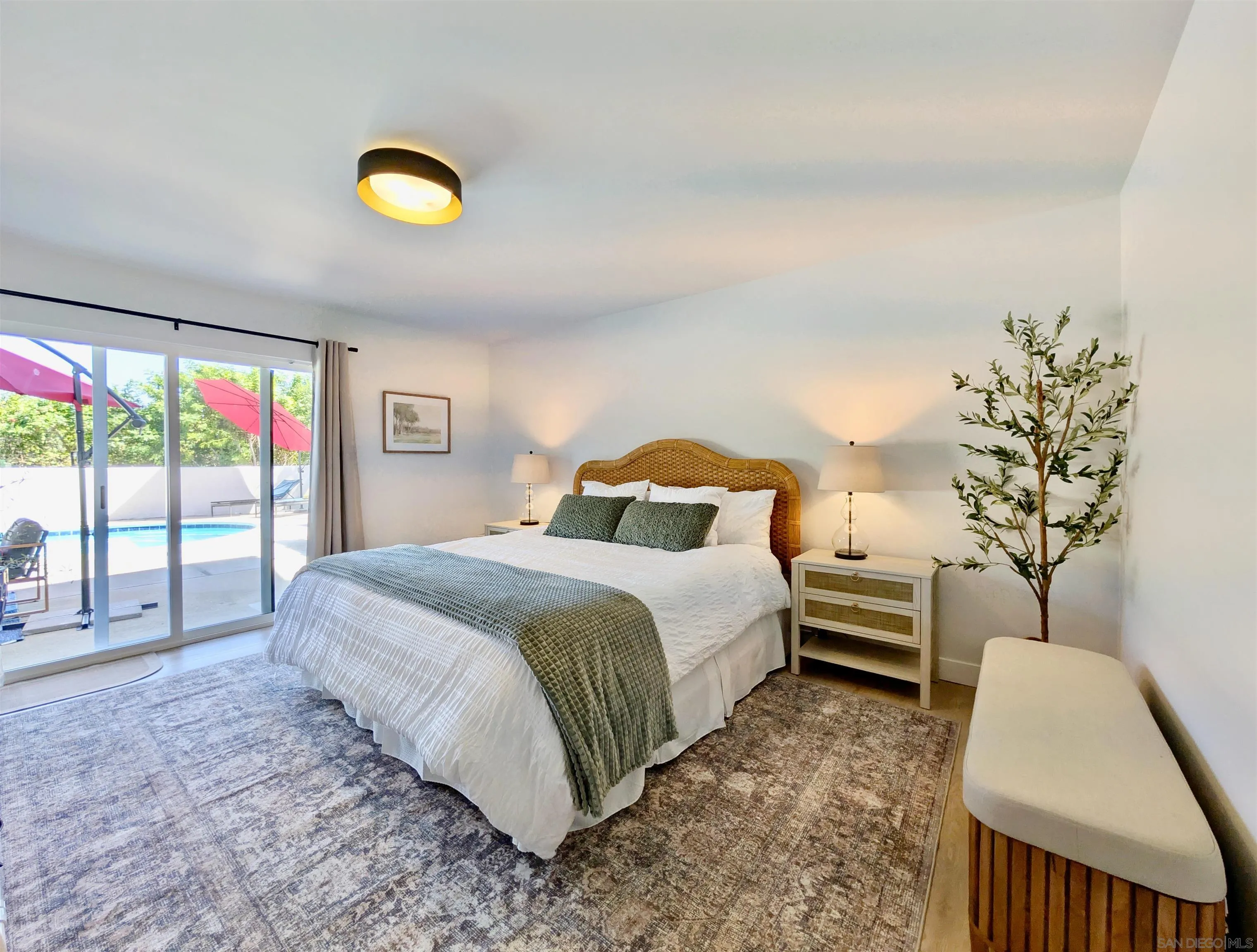 4242 Avenida Gregory Spring Valley, CA 91977 - Photo 36 of 53 a bedroom with a bed and a large window
