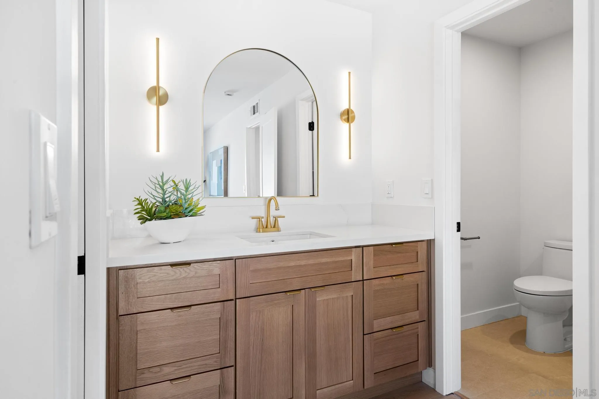 4242 Avenida Gregory Spring Valley, CA 91977 - Photo 38 of 53 a bathroom with a sink a toilet and mirror