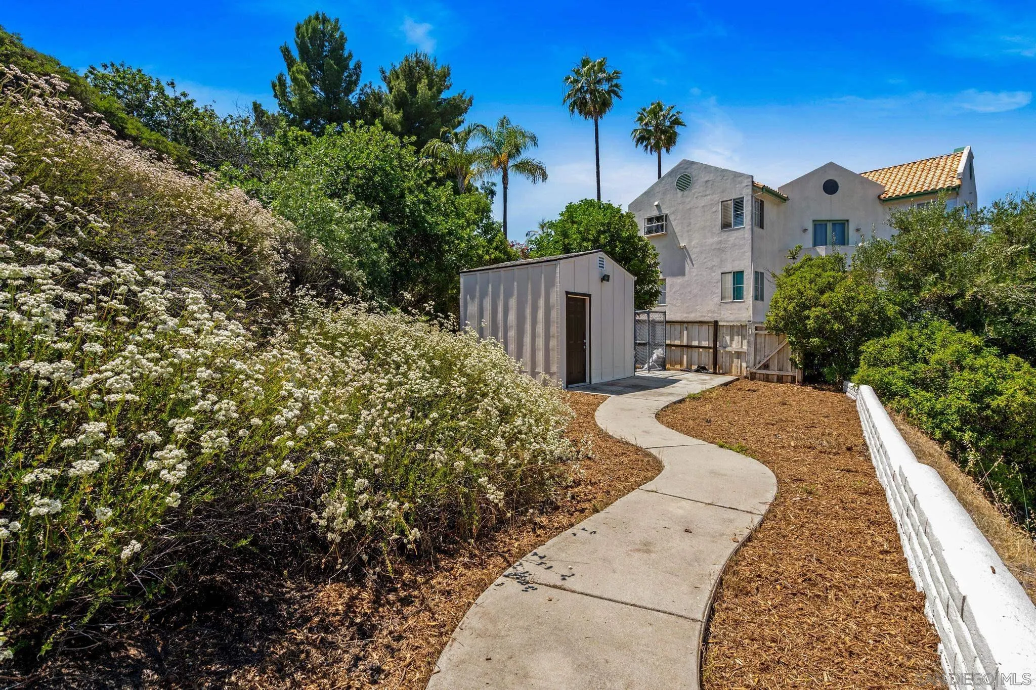 4242 Avenida Gregory Spring Valley, CA 91977 - Photo 47 of 53 a view of a house with a yard and potted plants