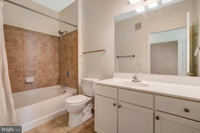 a bathroom with a sink a toilet and a bathtub