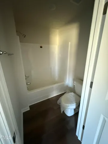 a bathroom with a toilet and a sink