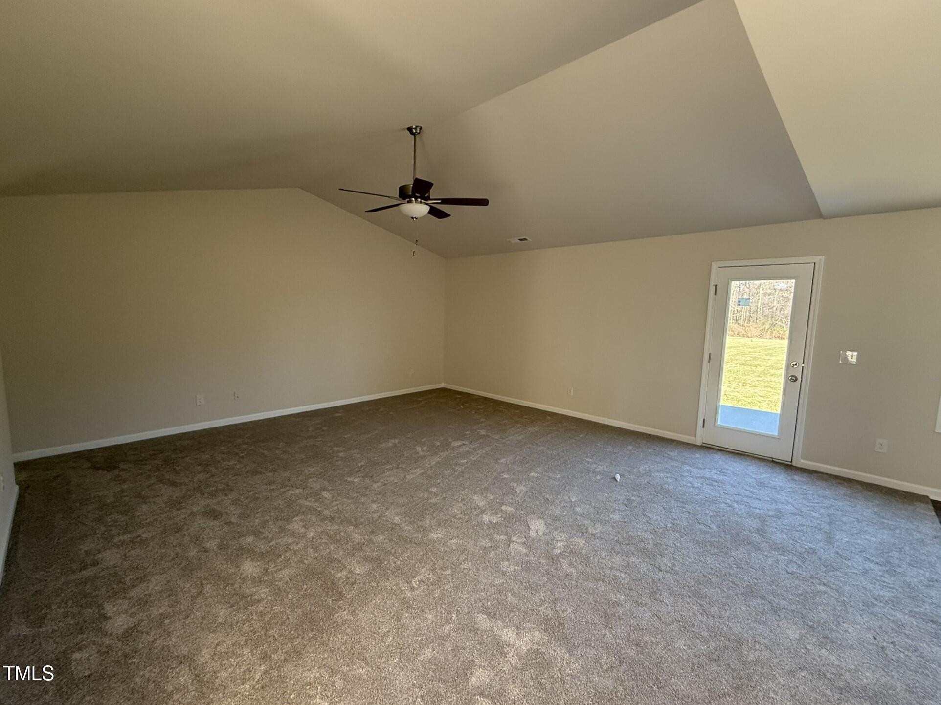148 Phil Jack Road Dunn, NC 28334 - Photo 4 of 18 an empty room with a empty space and windows