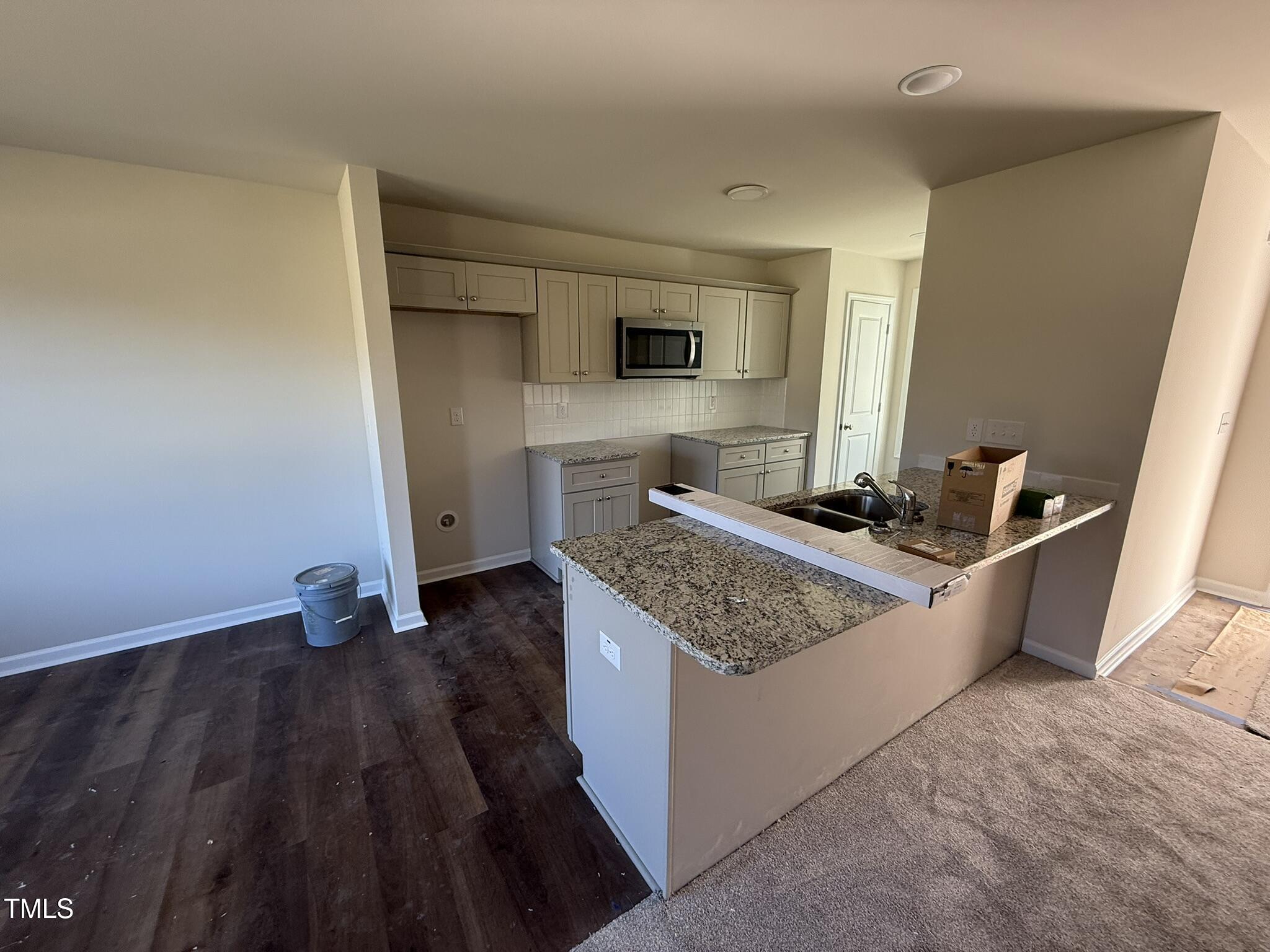 148 Phil Jack Road Dunn, NC 28334 - Photo 8 of 18 a kitchen with sink and refrigerator