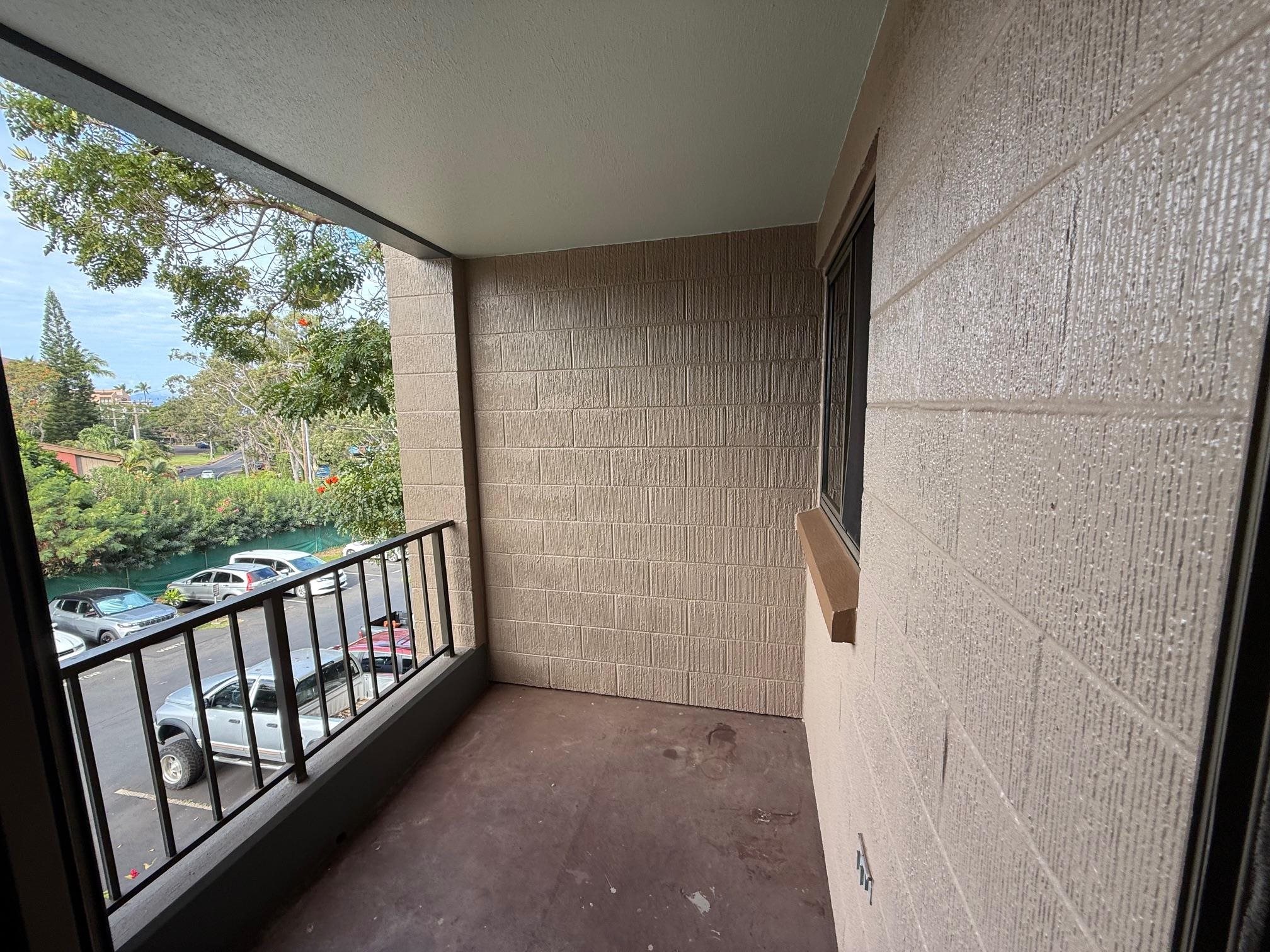 4310 Lower Honoapiilani Road, Unit 315 Lahaina, HI 96761 - Photo 13 of 20 a view of a balcony with wooden floor
