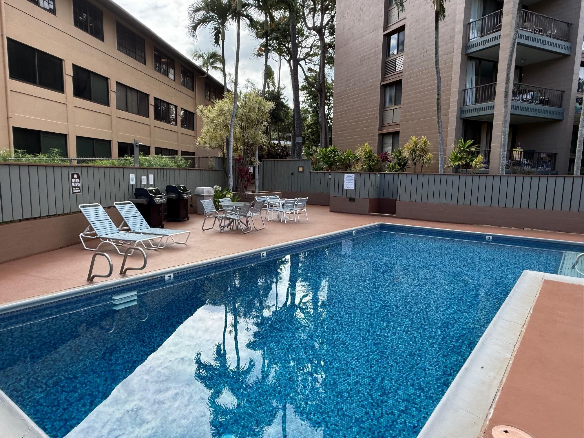 4310 Lower Honoapiilani Road, Unit 315 Lahaina, HI 96761 - Photo 16 of 20 a view of a patio with chairs and potted plants