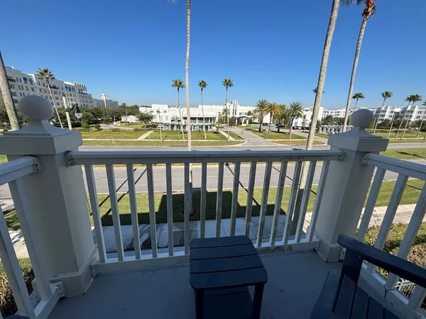 a view of a balcony with chairs