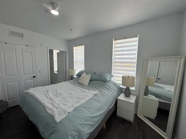 a bedroom with a bed and a couch