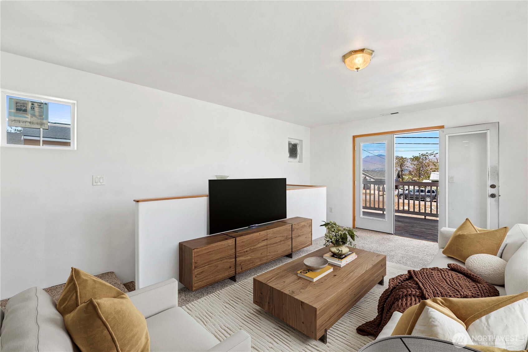 203 Marr Street Wenatchee, WA 98801 - Photo 13 of 22 a living room with furniture and a flat screen tv