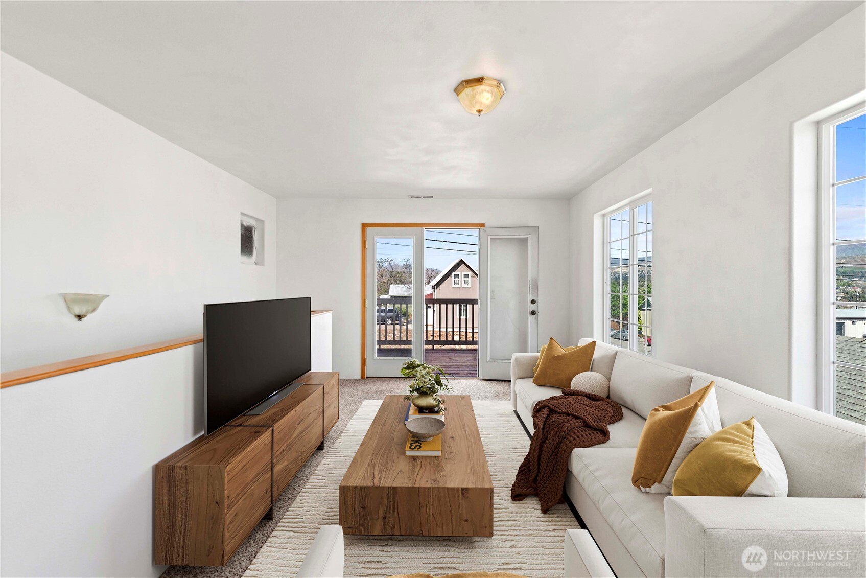 203 Marr Street Wenatchee, WA 98801 - Photo 15 of 22 a living room with furniture and a flat screen tv