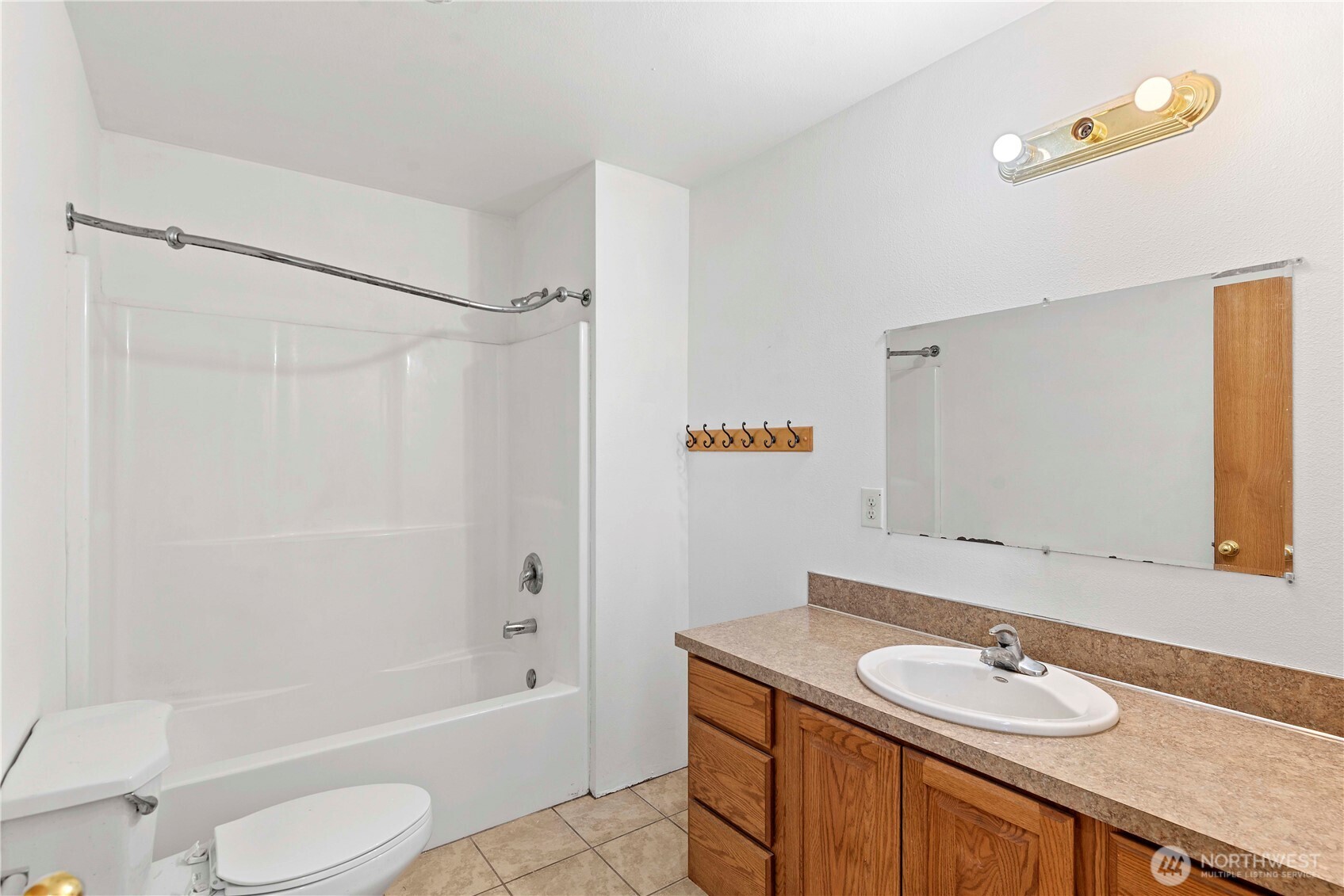 203 Marr Street Wenatchee, WA 98801 - Photo 20 of 22 a bathroom with a granite countertop sink toilet and shower