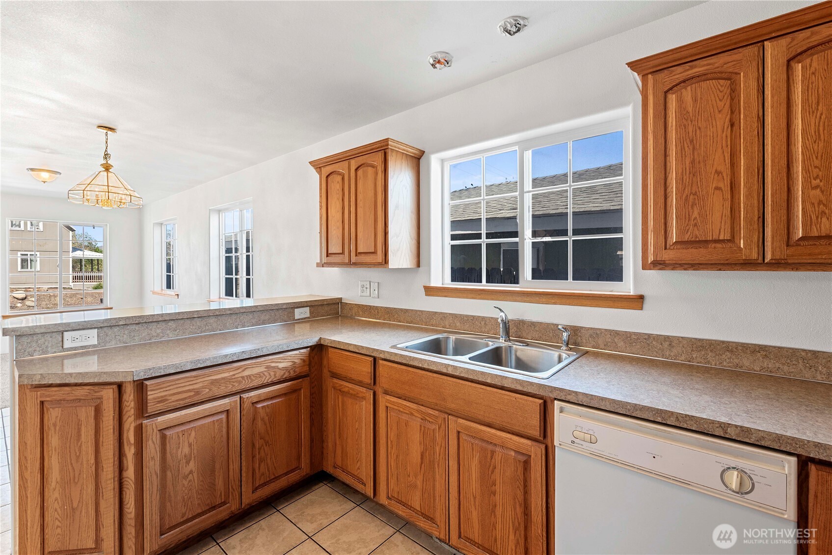 203 Marr Street Wenatchee, WA 98801 - Photo 7 of 22 a kitchen with a sink and cabinets
