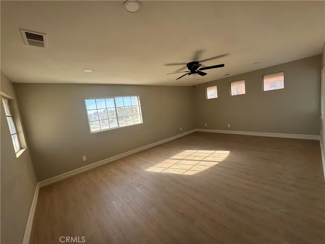 a view of empty room with windows