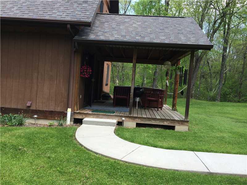 1406 Camp Coulter Road Knox, PA 16232 - Photo 22 of 25 Exterior Back. Side view of back porch and hot tub