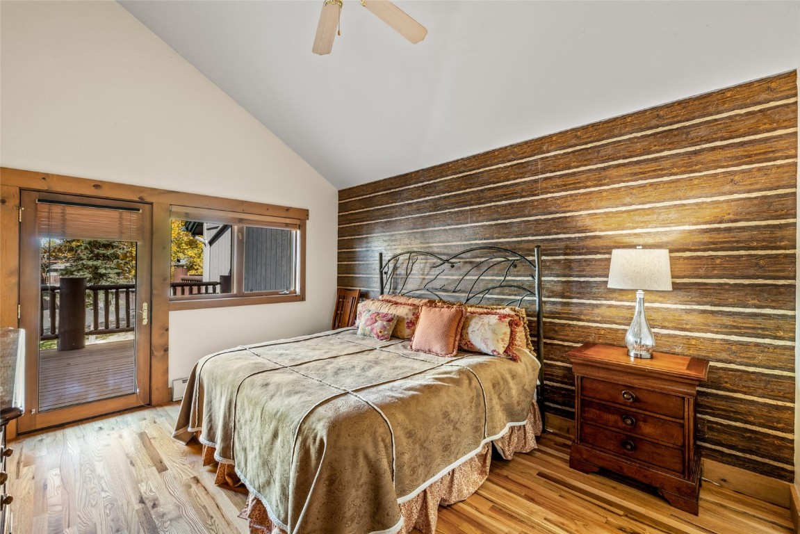 1775 Latigo Loop Steamboat Springs, CO 80487 - Photo 12 of 31 a bedroom with a bed and wooden floor