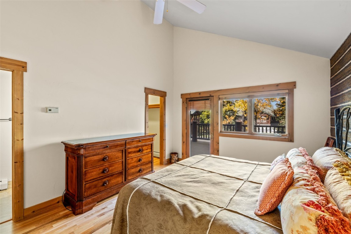 1775 Latigo Loop Steamboat Springs, CO 80487 - Photo 13 of 31 a bedroom with a bed and wooden floor
