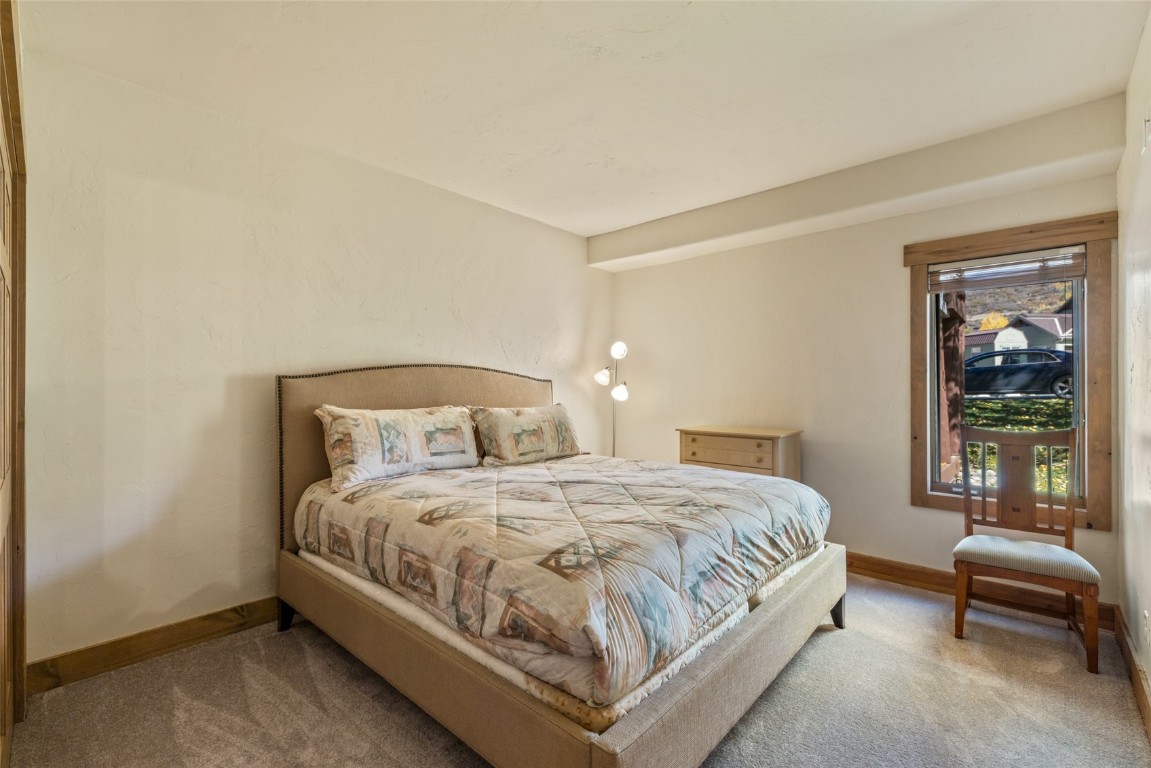 1775 Latigo Loop Steamboat Springs, CO 80487 - Photo 18 of 31 a bedroom with a bed and a window