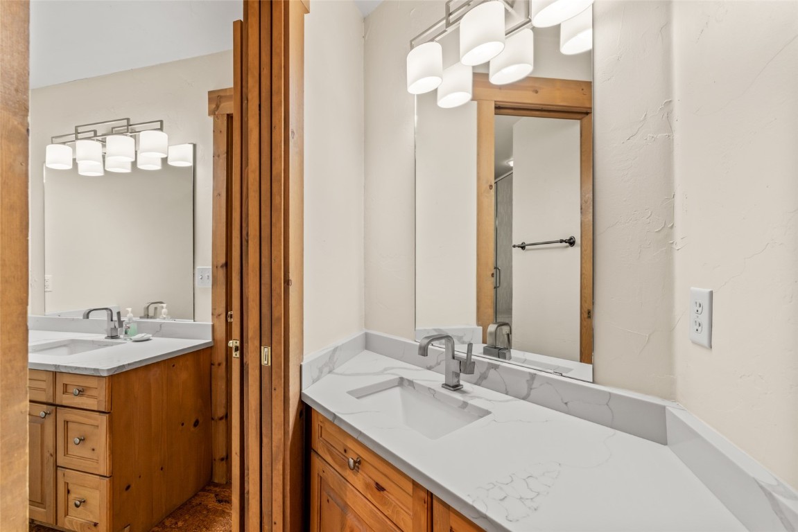 1775 Latigo Loop Steamboat Springs, CO 80487 - Photo 20 of 31 a bathroom with a sink vanity and a mirror