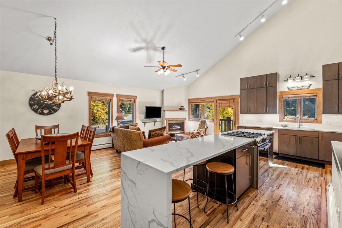 1775 Latigo Loop Steamboat Springs, CO 80487 - Photo 2 of 31 a view of a dining room with furniture window and wooden floor