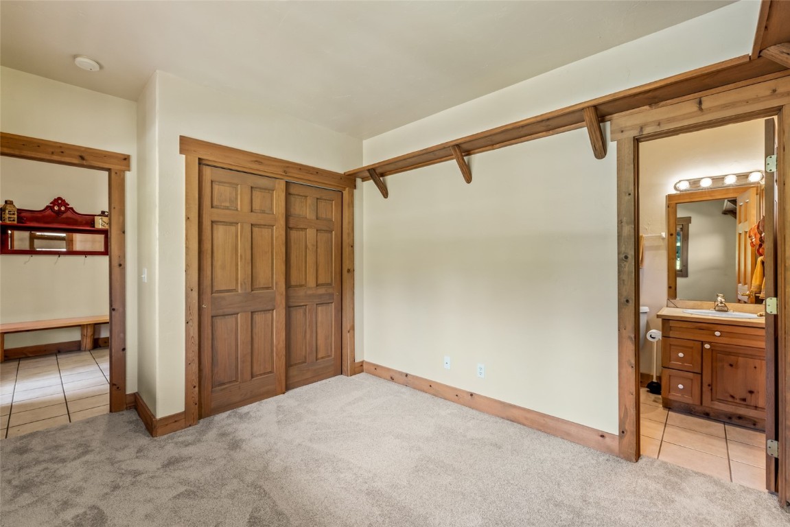 1775 Latigo Loop Steamboat Springs, CO 80487 - Photo 22 of 31 a view of a hallway with closet and a bathroom