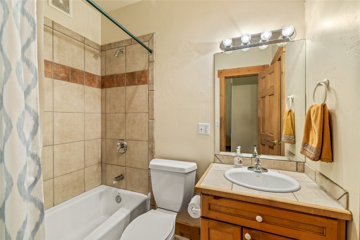 1775 Latigo Loop Steamboat Springs, CO 80487 - Photo 23 of 31 a bathroom with a sink toilet and shower