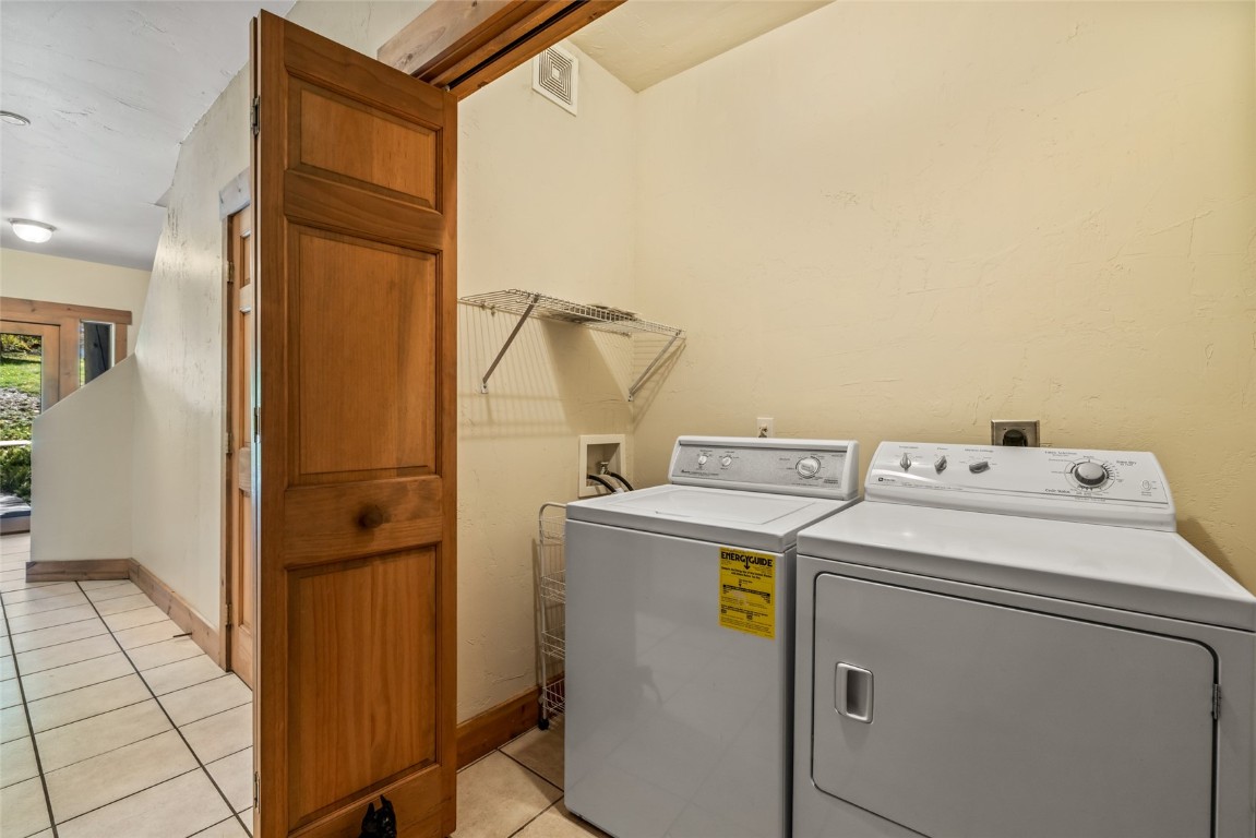 1775 Latigo Loop Steamboat Springs, CO 80487 - Photo 25 of 31 a utility room with dryer and washer