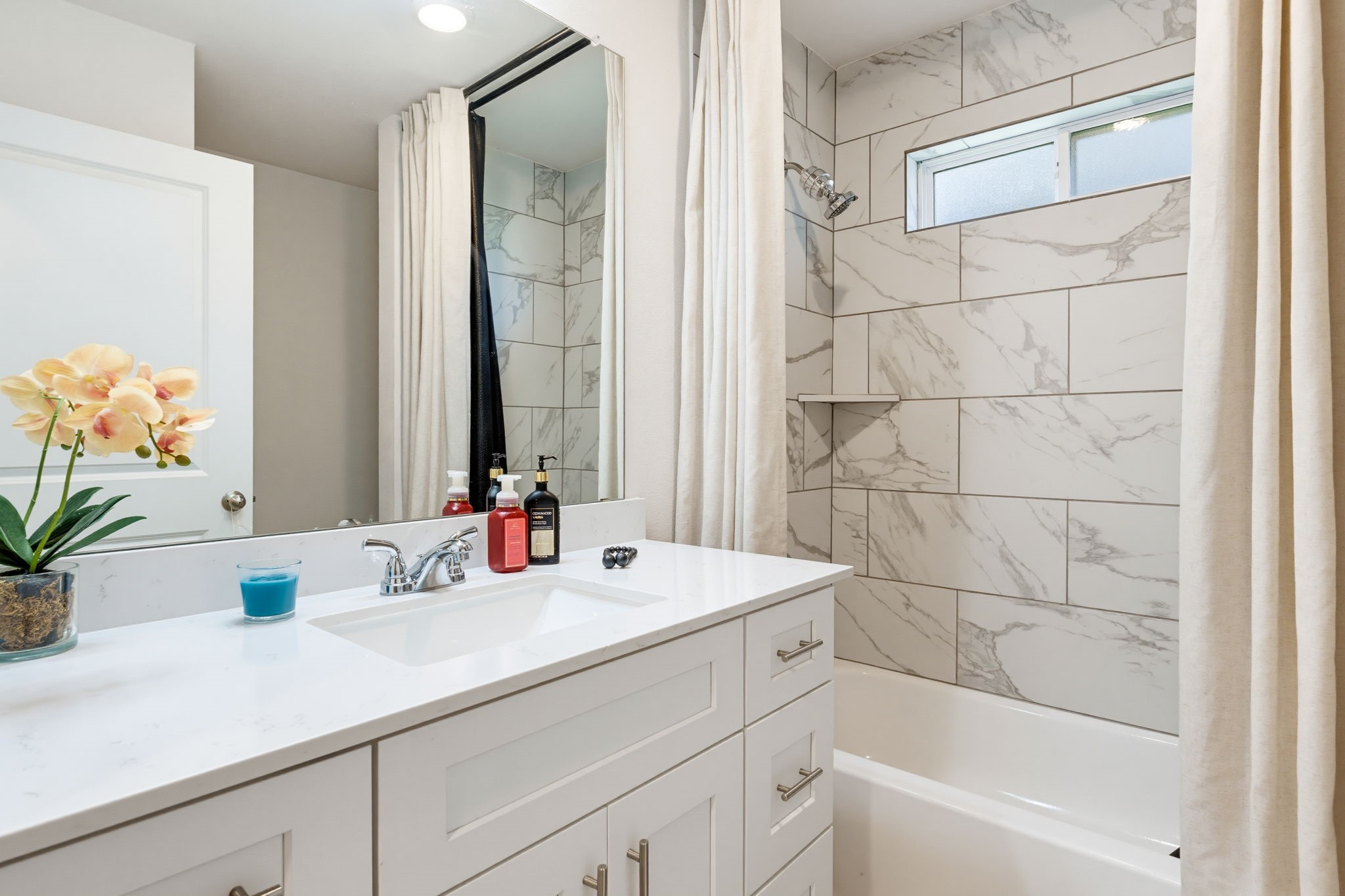 316 Windstar Road Liberty Hill, TX 78642 - Photo 21 of 27 a bathroom with a sink and a mirror