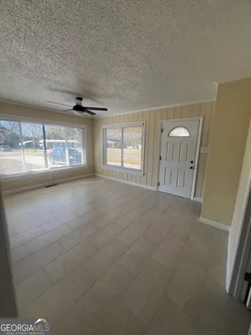 a view of an entryway with wooden floor