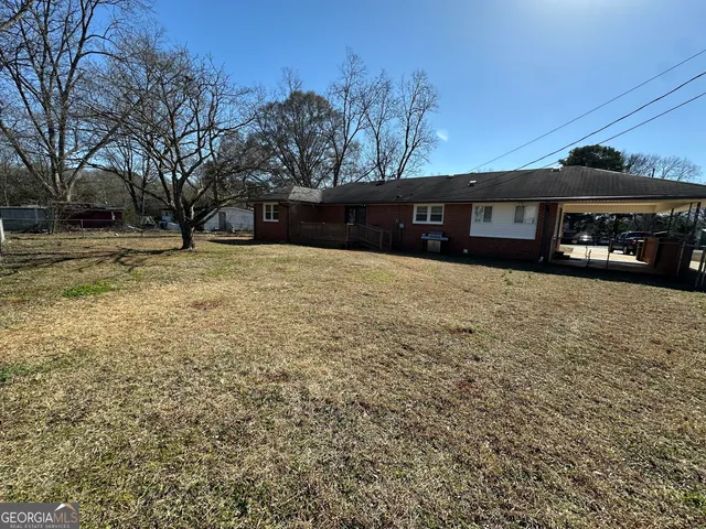 a bathroom with a bathtub shower sink and mirror