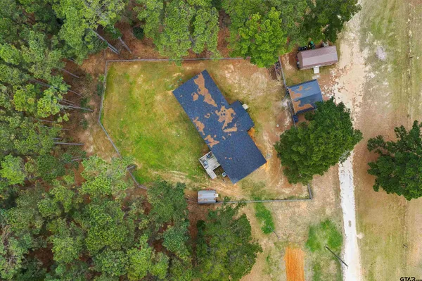 an aerial view of residential house with outdoor space and swimming pool