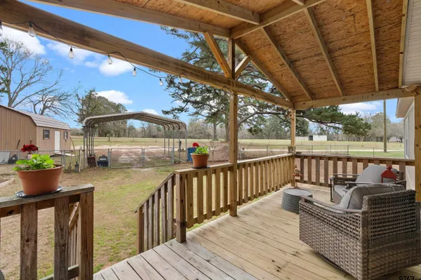 a view of balcony with wooden floor
