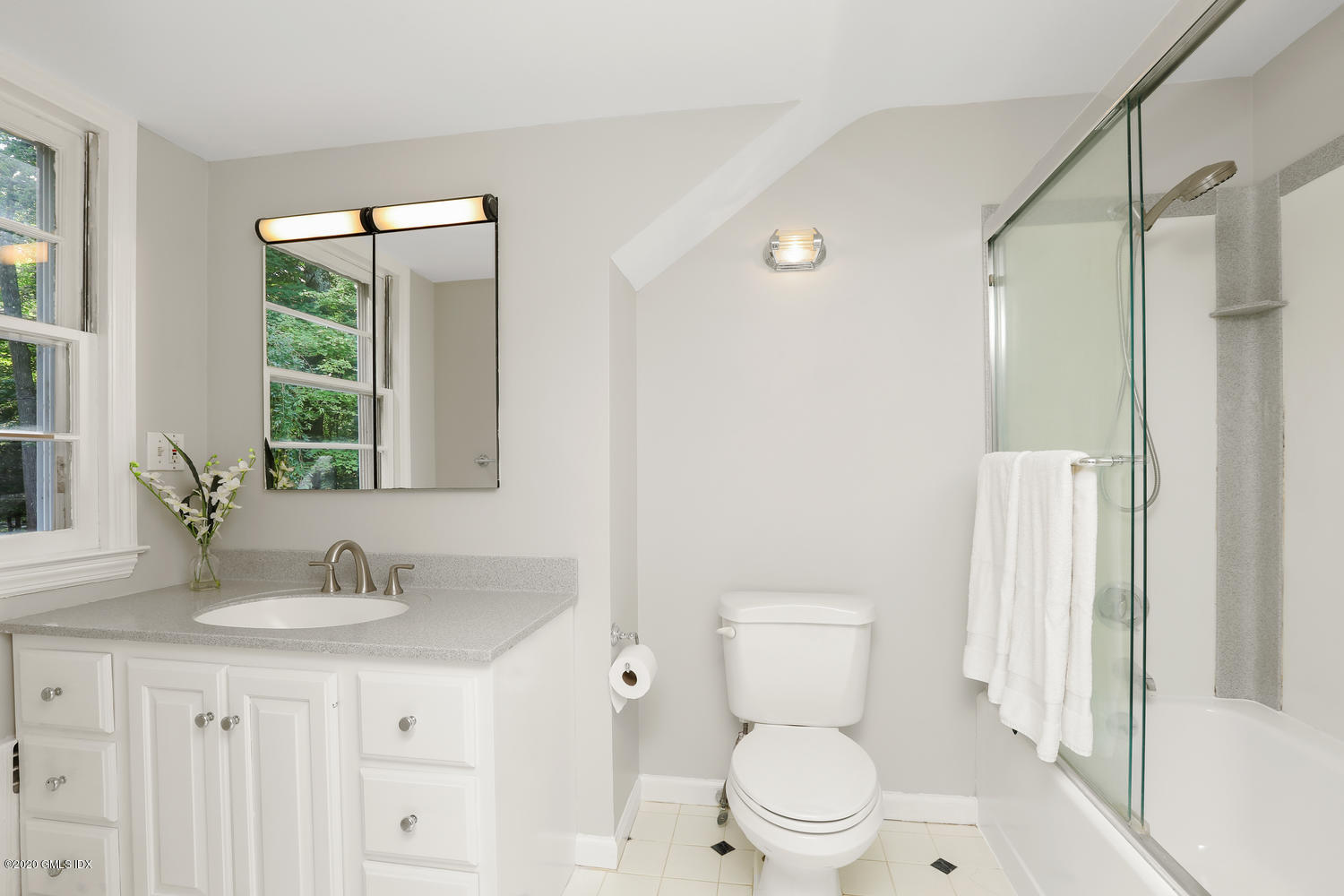 262 Eden Road Stamford, CT 06907 - Photo 13 of 38 a bathroom with a granite countertop sink a toilet and a mirror