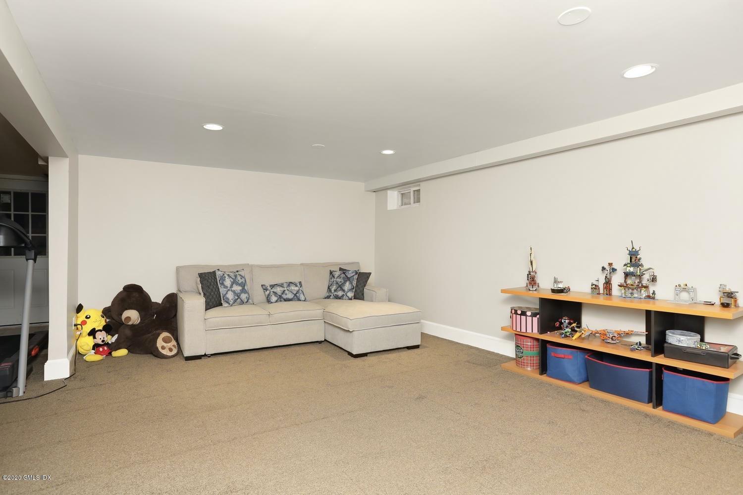 262 Eden Road Stamford, CT 06907 - Photo 20 of 38 a living room with furniture and a table