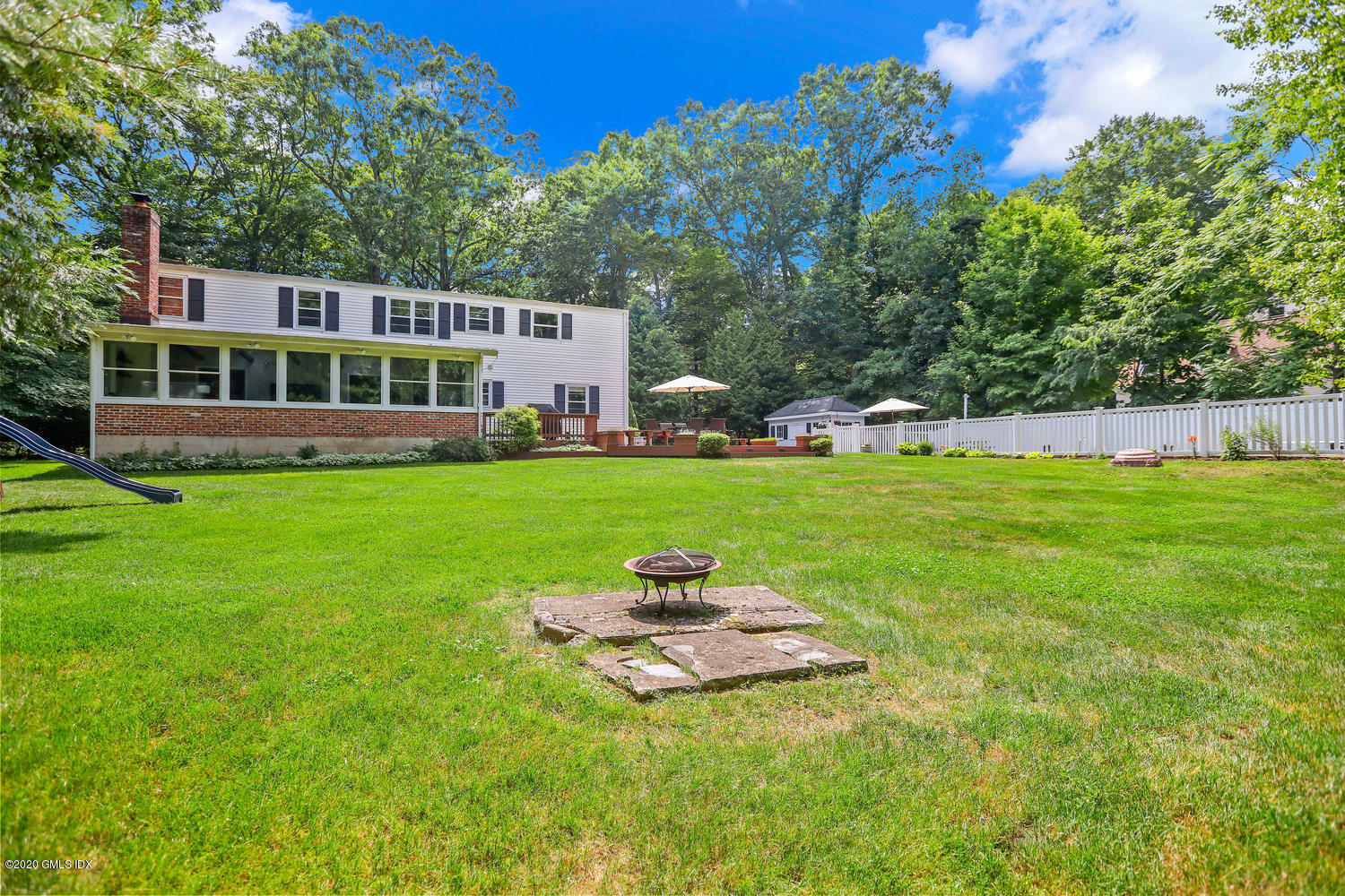 262 Eden Road Stamford, CT 06907 - Photo 22 of 38 a front view of a house with a yard