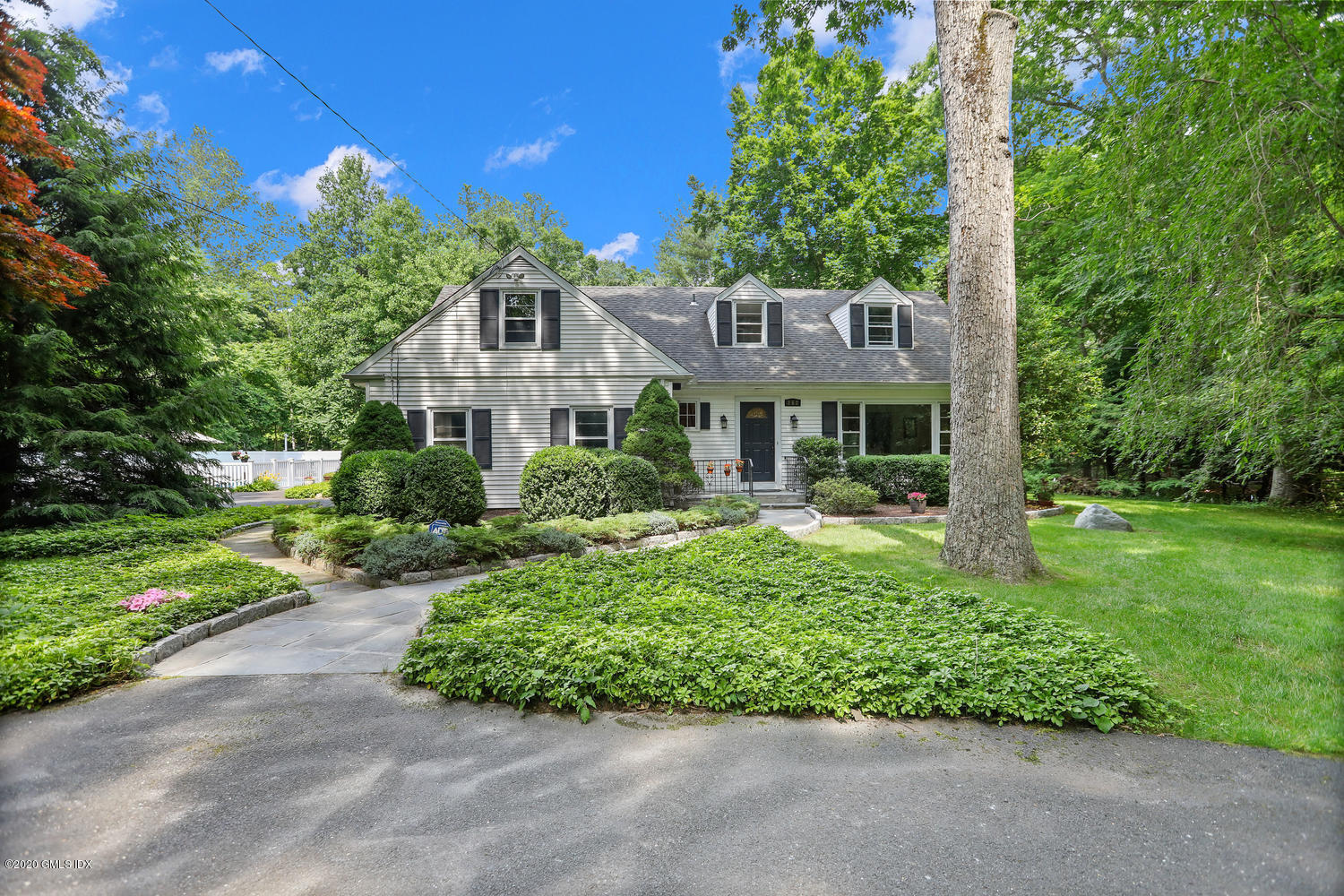 262 Eden Road Stamford, CT 06907 - Photo 33 of 38 a front view of a house with a yard