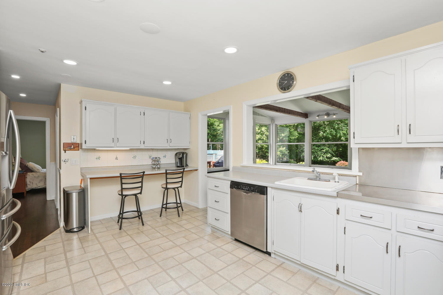 262 Eden Road Stamford, CT 06907 - Photo 9 of 38 a kitchen with white cabinets and sink