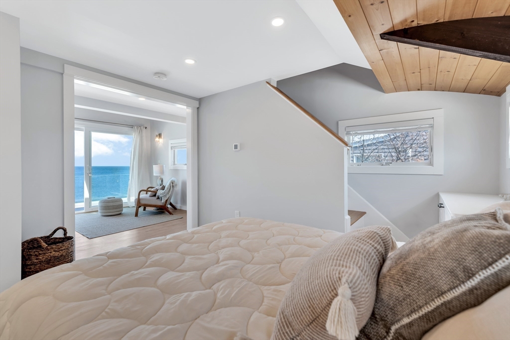 90 Salt Marsh Road East Sandwich, MA 02537 - Photo 23 of 40 a bed room with a bed and a large mirror