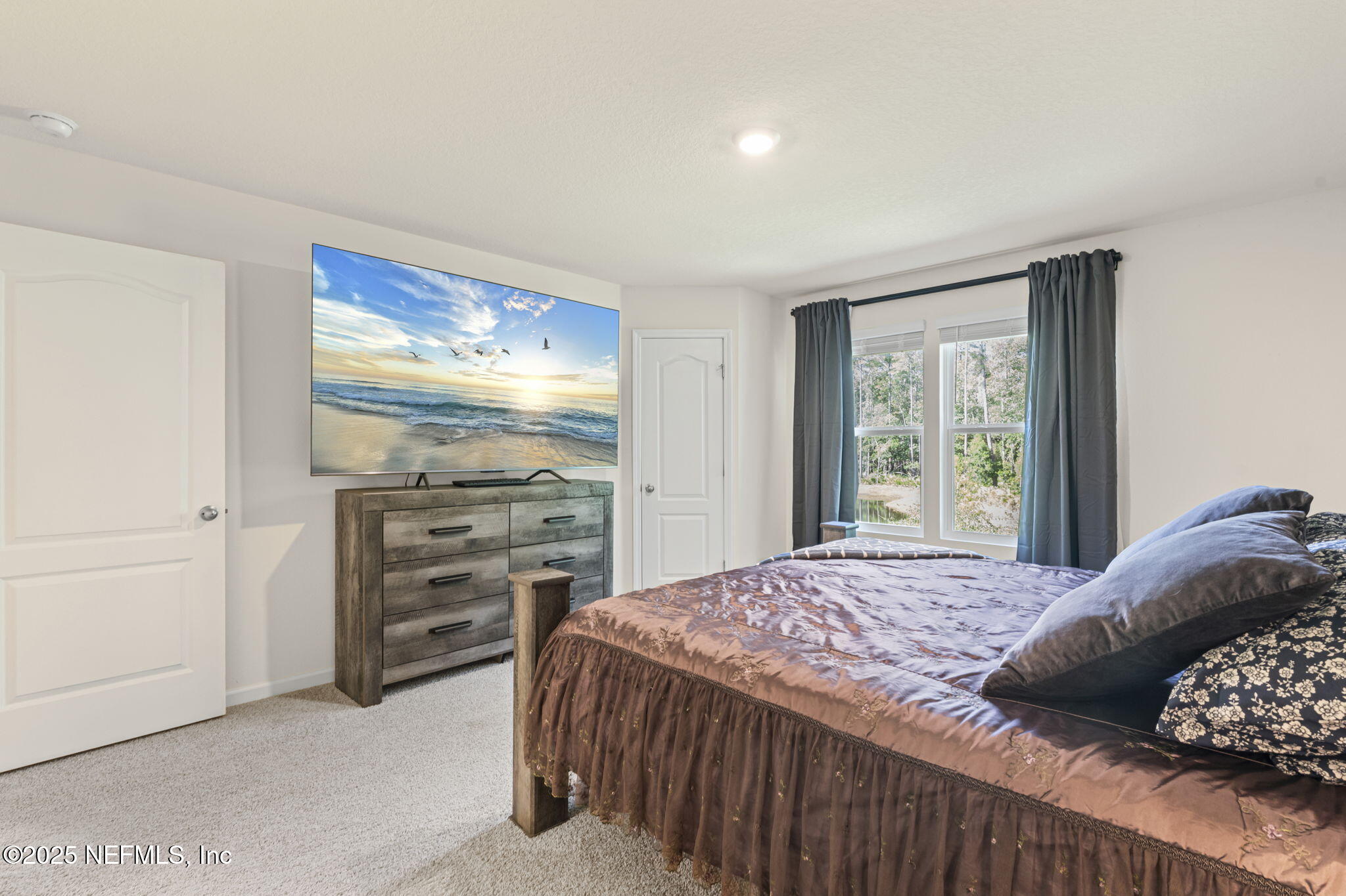 263 Talulla Trail St. Augustine, FL 32095 - Photo 14 of 32 a bedroom with a bed and a window