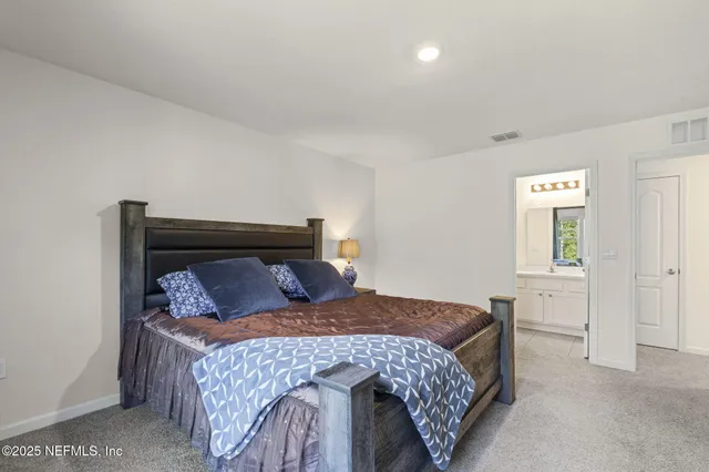 a bedroom with a bed and a cabinets