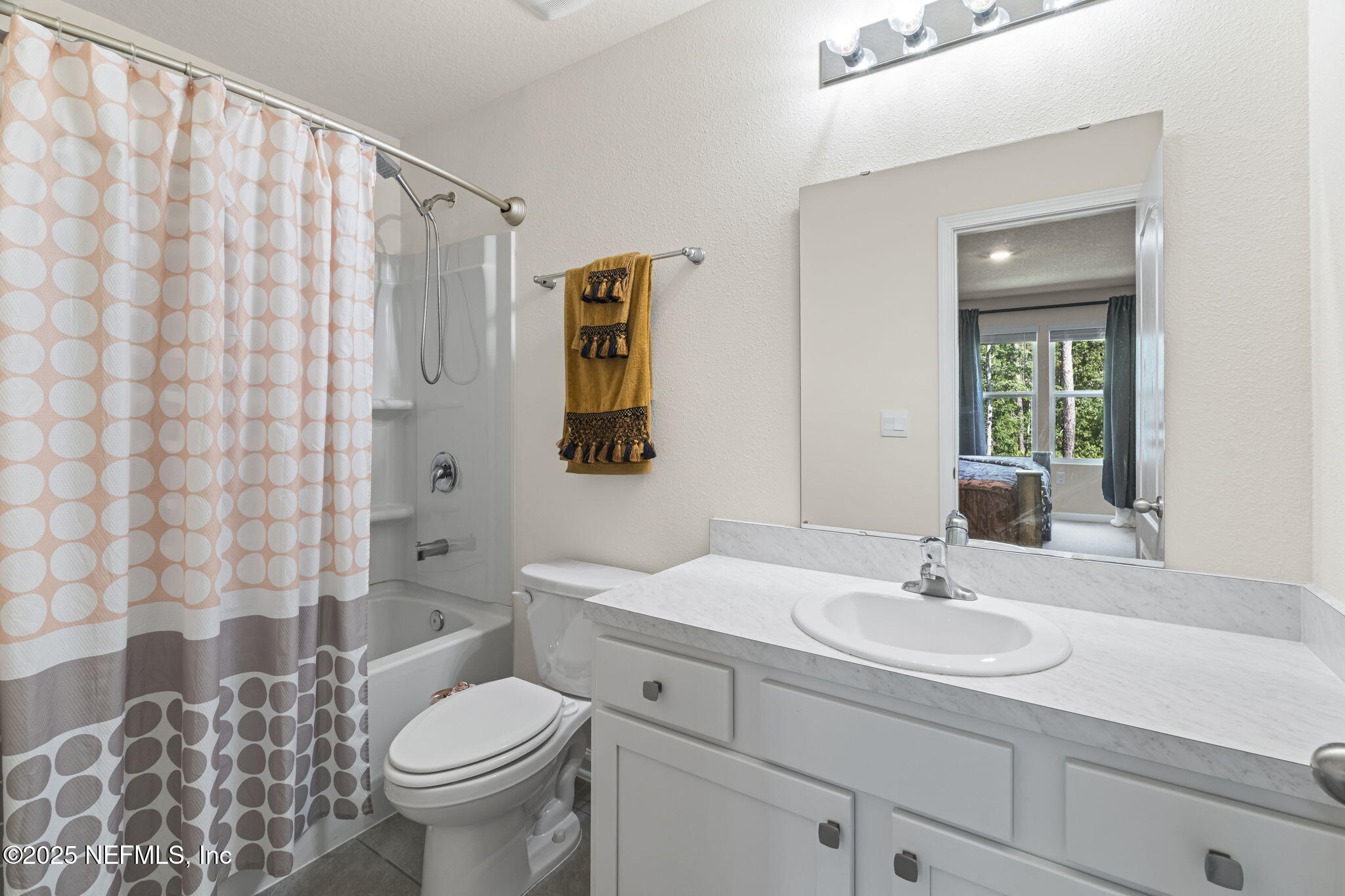 263 Talulla Trail St. Augustine, FL 32095 - Photo 17 of 32 a bathroom with a sink toilet and shower