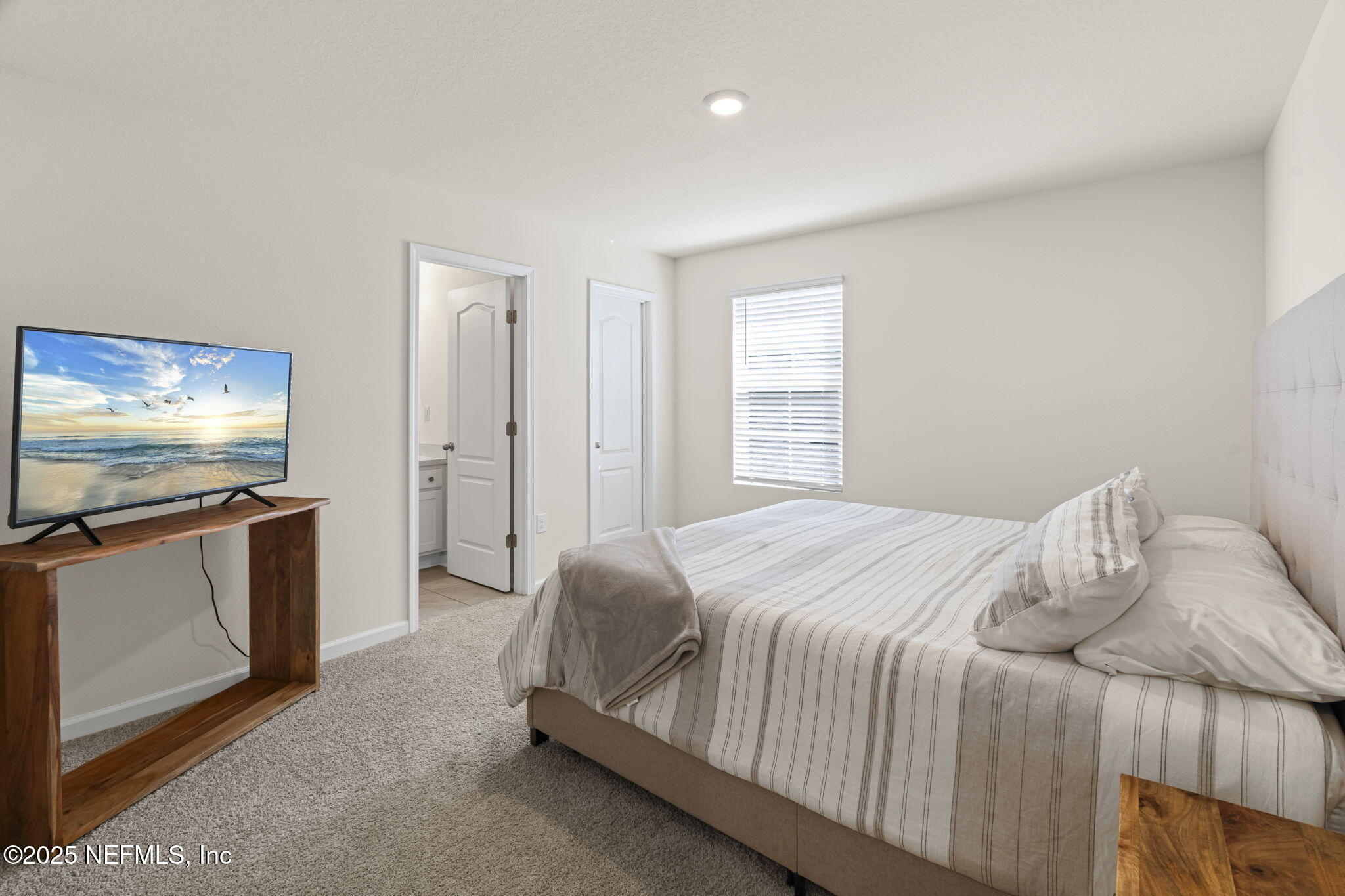 263 Talulla Trail St. Augustine, FL 32095 - Photo 18 of 32 a bedroom with a bed and a flat screen tv