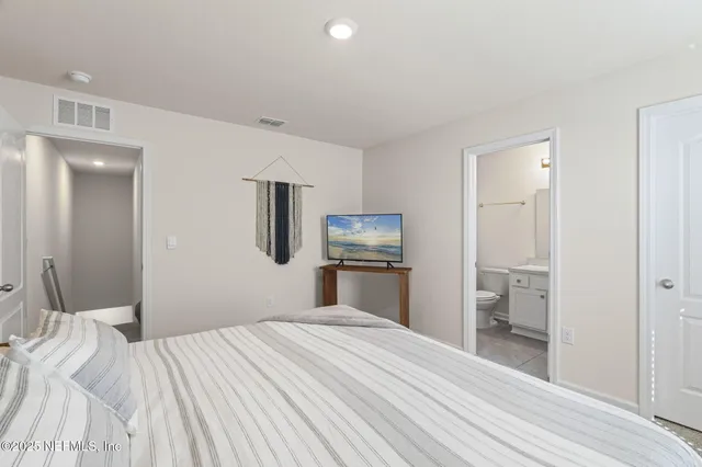 a bedroom with a bed and closet