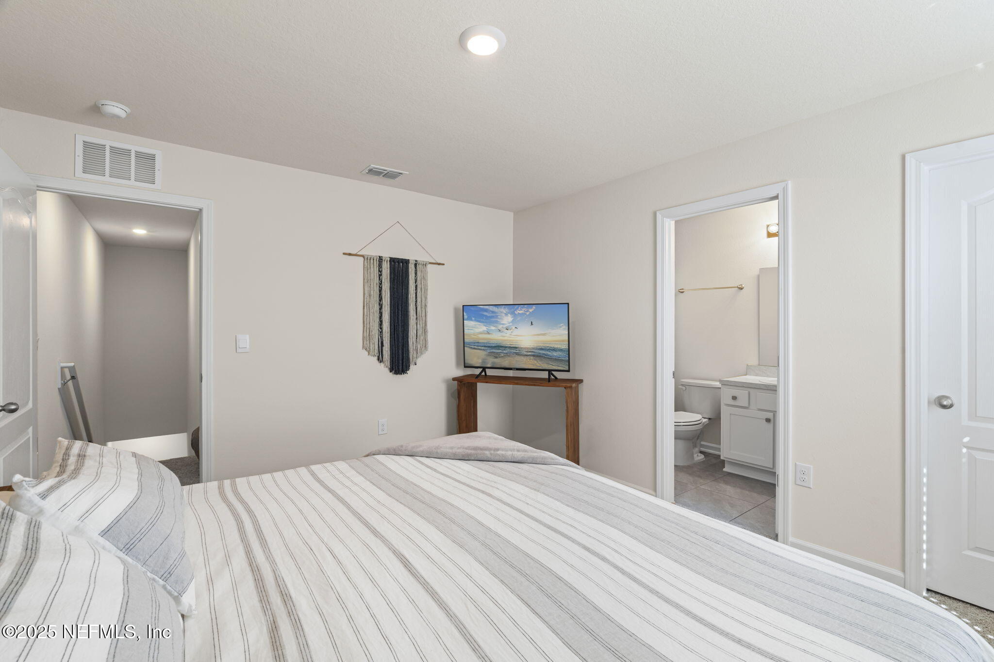 263 Talulla Trail St. Augustine, FL 32095 - Photo 19 of 32 a bedroom with a bed and closet