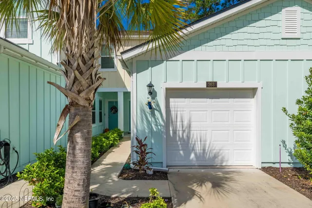 an aerial view of a house with a swimming pool and outdoor space